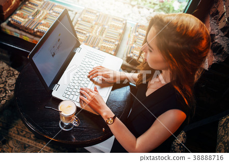 Top view of young female student working on laptop Top view of young female student working on laptop 38888716