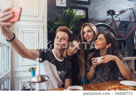 Group of cute teenagers taking selfie with 38888755