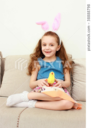 Cute little girl with bunny ears and cuddly toy Cute little girl with bunny ears and cuddly toy 38888798