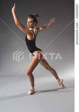 Slender female dancer enjoying sportive hobby Slender female dancer enjoying sportive hobby 38888867