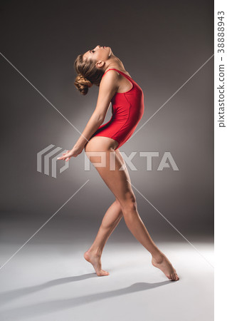 Athletic woman showing body flexibility 38888943
