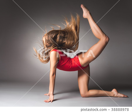 Flexible young girl doing sport Flexible young girl doing sport 38888978