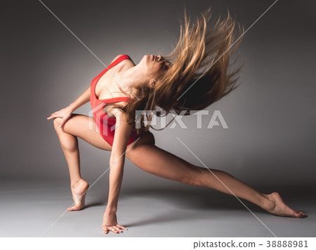 Flexible gymnast doing the splits Flexible gymnast doing the splits 38888981