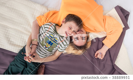Mother with son on bed, mother and son having fun Mother with son on bed, mother and son having fun 38889931