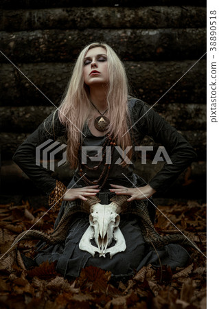 Witch in a long black dress 38890518