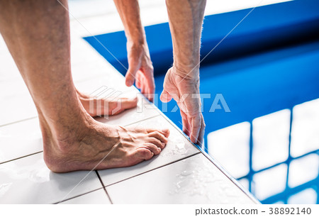 Unrecognizable man standing on the edge of the 38892140