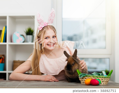 Teenage girl holding Easter eggs Teenage girl holding Easter eggs 38892751