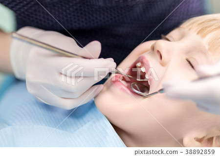 Baby girl visiting stomatology clinic.  38892859