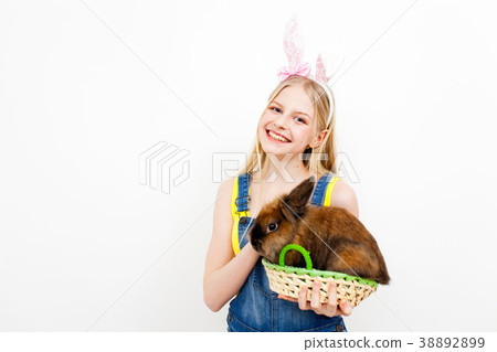 Teenage girl holding Easter eggs Teenage girl holding Easter eggs 38892899