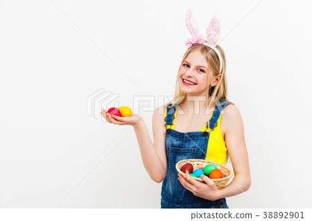 Teenage girl holding Easter eggs Teenage girl holding Easter eggs 38892901