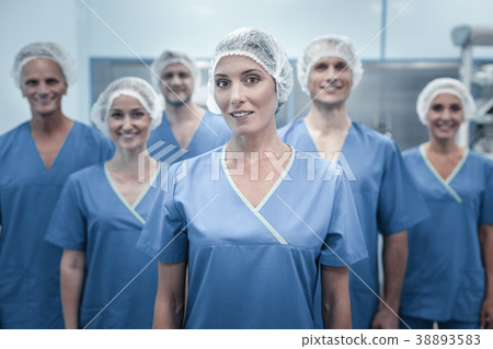 Confident perspective doctor smiling and looking Confident perspective doctor smiling and looking 38893583