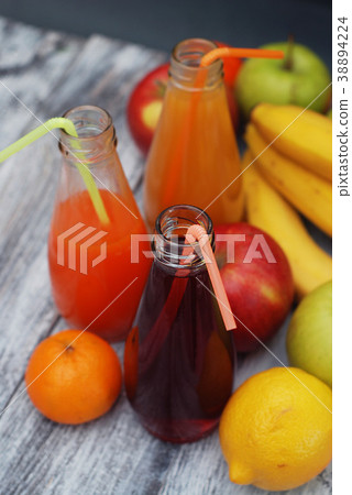 Juice Glasses of Fruit juice with colorful fruits 38894224