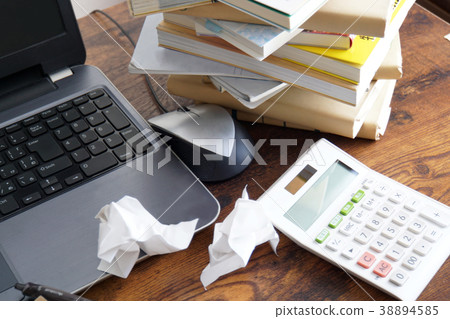 A messy desk 38894585