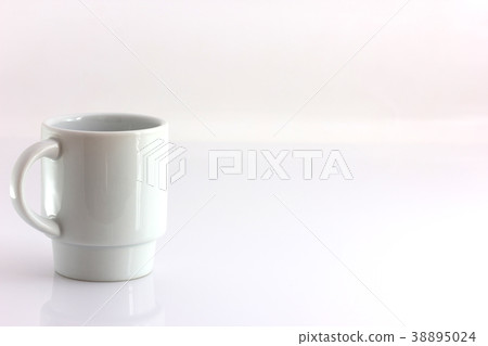 White coffee cup with a handle isolate 38895024
