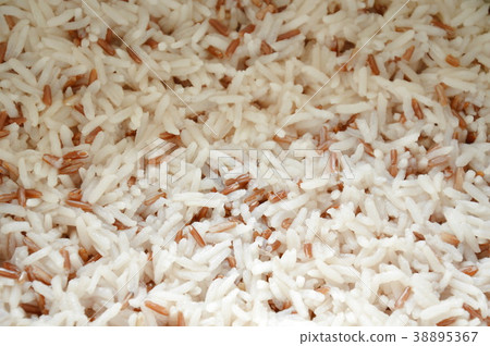 Mixed red cargo rice steamed in cooking pot Mixed red cargo rice steamed in cooking pot 38895367