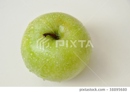 green apple with water drop on tile background green apple with water drop on tile background 38895680