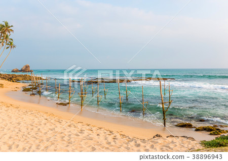 Beautiful seascape, boulders and palms Beautiful seascape, boulders and palms 38896943
