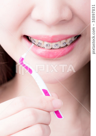 woman take interdental brush 38897831