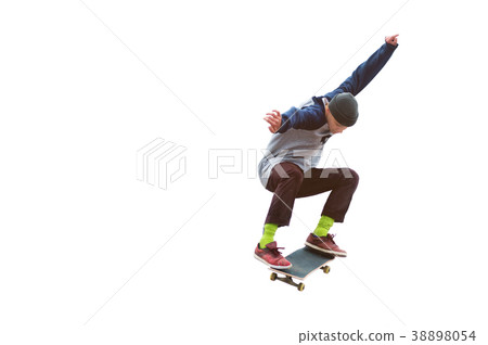 A teenager skateboarder jumps an ollie on an A teenager skateboarder jumps an ollie on an 38898054