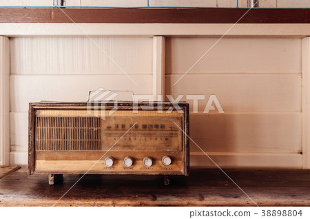 Antique vintage radio pastel wooden background Antique vintage radio pastel wooden background 38898804