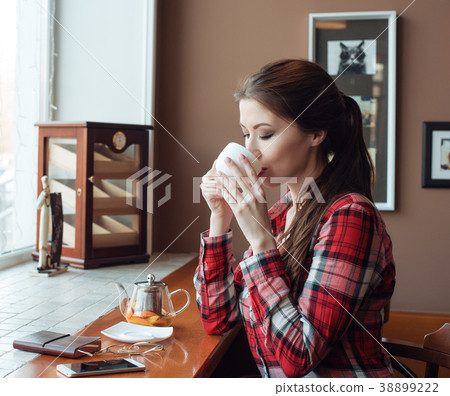 Girl student in a plaid shirt, in the afternoon in Girl student in a plaid shirt, in the afternoon in 38899222