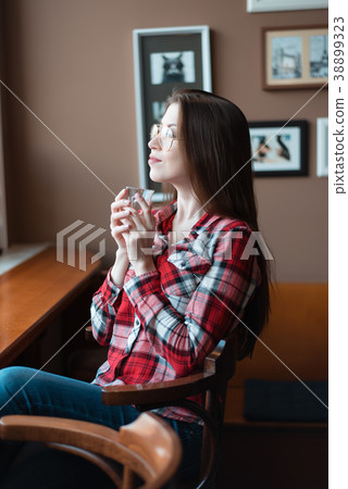 The brunette girl with glasses and a shirt, in the 38899323