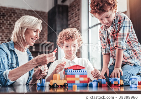 Happy positive family playing with the constructor 38899960