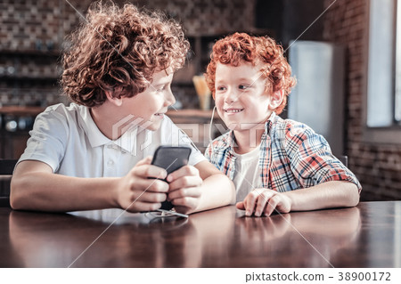 Joyful nice boys listening to music Joyful nice boys listening to music 38900172
