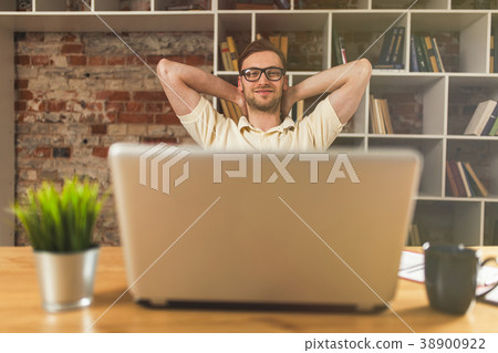 Young man with a laptop Young man with a laptop 38900922