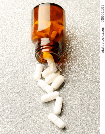 Pill bottle from white pills 38901192