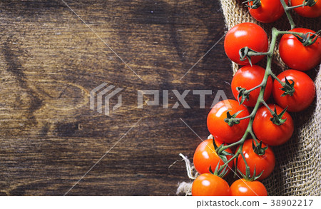 Branch with fresh cherry tomatoes. Ripe red 38902217