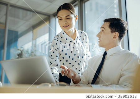 Young man being surprised by the expertise of his 38902618