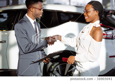 Customer buying a vehicle at car dealership. woman 38903041