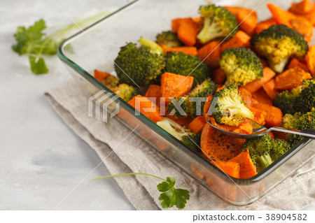 Baked broccoli and sweet potato with spices  38904582