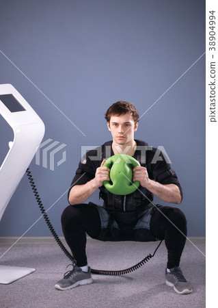 Man in electric muscular suit to stimulate with Man in electric muscular suit to stimulate with 38904994