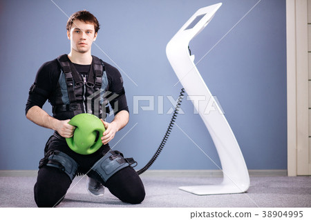 Man in electric muscular suit to stimulate with Man in electric muscular suit to stimulate with 38904995