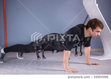 man in Electrical Muscular Stimulation suits doing man in Electrical Muscular Stimulation suits doing 38904996