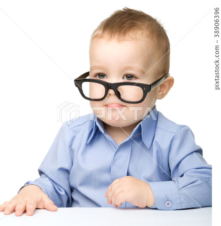 Portrait of a cute little boy wearing glasses Portrait of a cute little boy wearing glasses 38906396