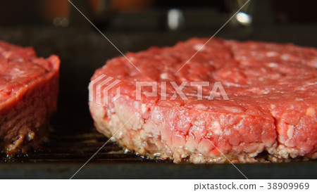 Fresh Beefsteaks on a grill Fresh Beefsteaks on a grill 38909969