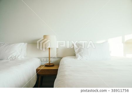 White pillow on the bed White pillow on the bed 38911756