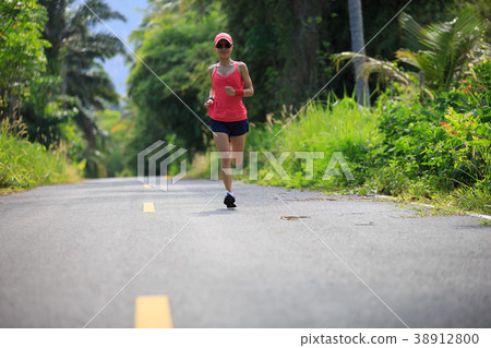 fitness female runner running on trail 38912800