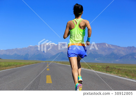 woman runner running on road woman runner running on road 38912805