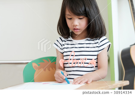 Cute asian girl drawing color in classroom 38914334