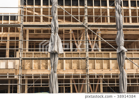 Construction site of wooden apartment under construction 38914384