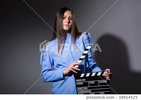 Young beautiful woman with movie cracker 38914525