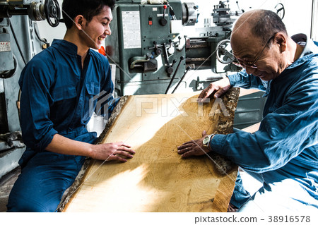 Engineer at manufacturing workshop 38916578