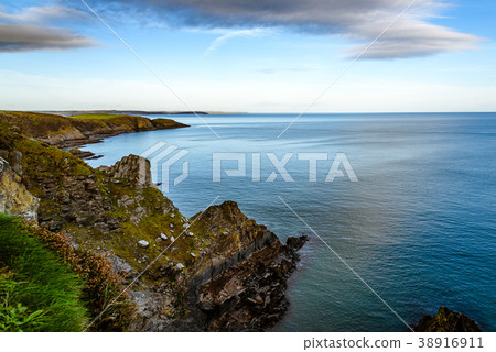 Scenic view of cliffs in Irish coast at sunset. Scenic view of cliffs in Irish coast at sunset. 38916911