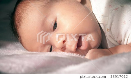 Cute newborn baby girl close-up portrait 38917012