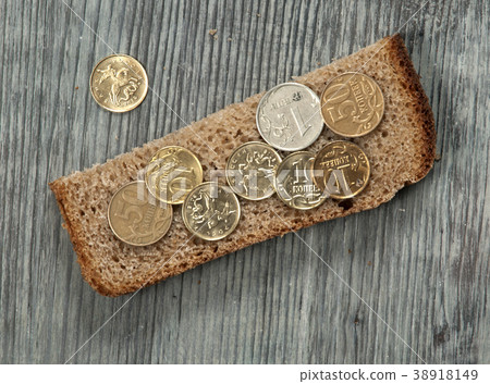 Rye bread with coins Rye bread with coins 38918149