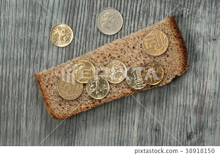 Rye bread with coins Rye bread with coins 38918150
